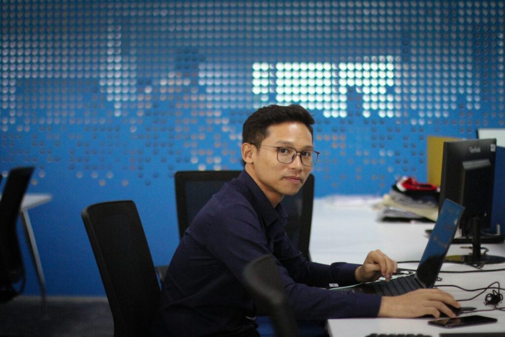 Zhao's Pardon: A New Era for Cryptocurrency? 11 a man sitting at a desk with a computer