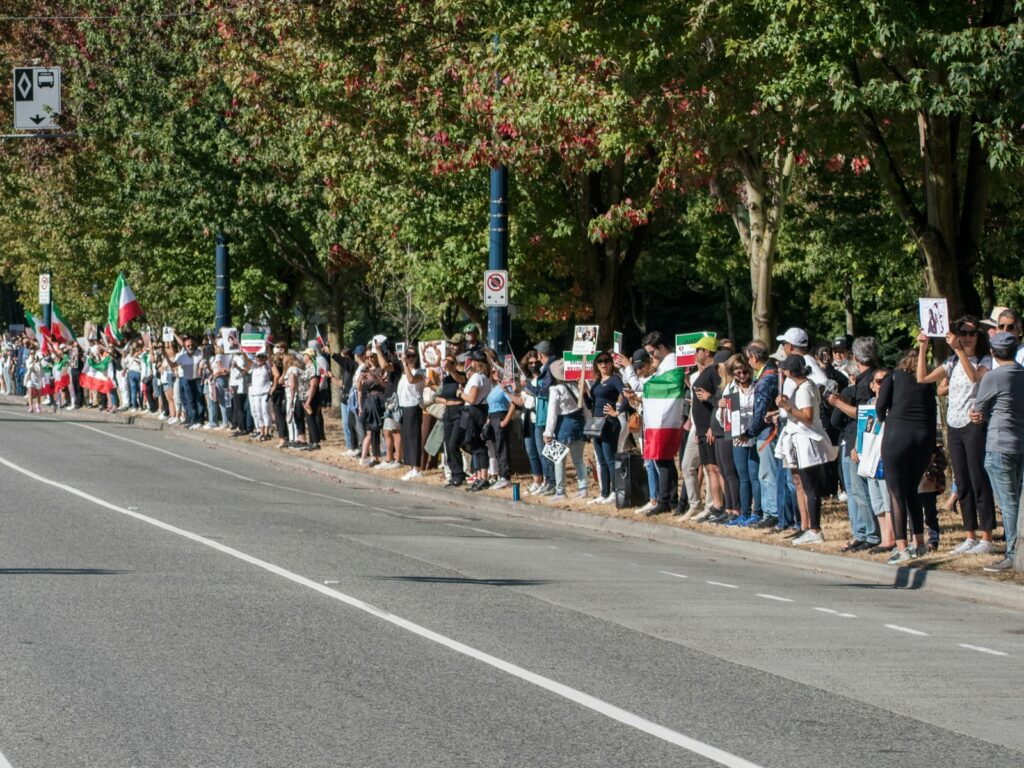 BREAKING: Britain Decides ‘Why Be Fast When You Can Be the Slowest?’—Unveils Europe’s LONGEST Immigration Queue 6 a large group of people marching on the street