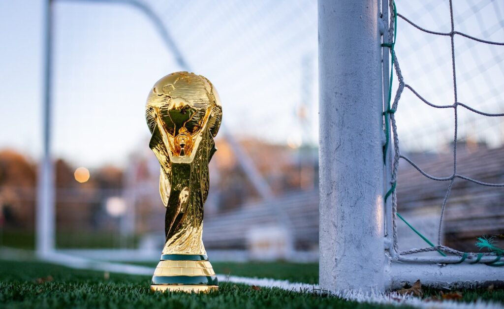 The Science of Success: How India’s "Compound" Strategy Secured the 2026 T20 World Cup Final Spot 1 a golden soccer trophy sitting on top of a soccer field