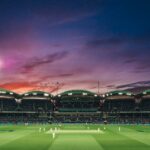 India vs. New Zealand: The Final Countdown – Breaking the "Kiwi Curse" in the 2026 T20 World Cup 2 people watching game of cricket during sunset
